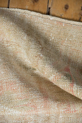 Vintage Distressed Oushak rug's time-softened pile revealing muted beige and blush tones.