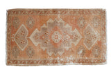 Hand-knotted distressed Oushak rug mat with apricot and beige serrated medallion, 1'8