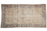 Distressed vintage Oushak runner, ivory-coffee with dusty cobalt floral vinery, mostly even wear, 2'8