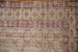 Distressed vintage Oushak rug, black cherry red and ivory geometric trellis pattern.