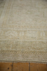 Distressed vintage Oushak rug pile showing even wear, light wefting speckling, and original selvage.