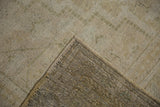 Textured pile with wefting speckling, intact selvage, and woven reverse of vintage Oushak carpet.