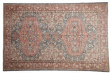 Distressed Turkish Oushak carpet with oversized double medallions in muted terra cotta and faded blue-grey.
