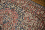 Textured distressed Oushak rug section with terra cotta, dusty blue, and beige scrolling vinery.