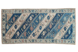 Distressed vintage Oushak runner with blue and ivory diagonal stripes, vinery, starburst border, 2'11