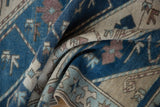 Textural detail of the distressed Oushak runner's diagonal stripes in powder blue and coffee brown.