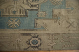 Even wear on a vintage Oushak rug highlighting simplistic geometric motifs in blue and beige.