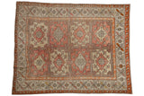 Vintage distressed Oushak carpet showcasing time-softened red, beige, and tangerine floral panel motifs.