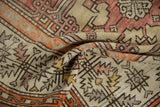 Distressed Oushak carpet texture with muted geometric floral patterns and serrated border.