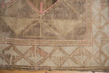 Distressed Oushak carpet border, wide geometric tone-on-tone in beige and pink.