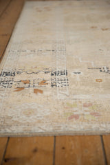 Textured pile of a distressed Oushak rug showing soft ivory and charcoal patterns.