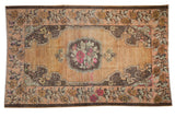 Vintage Distressed Oushak rug, fuchsia rose medallion on abrashed peach field, 4'8