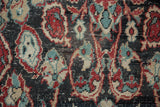 Vintage distressed Oushak rug detail, showing worn pile, visible foundation, and colorful patterns.