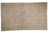 Distressed Vintage Oushak carpet with muted rose and mint green medallion and floral motifs, 6' x 9'11