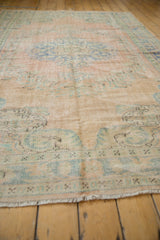 Distressed Oushak rug texture revealing low pile and foundation weave.