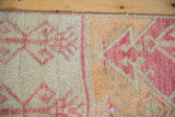Distressed short pile texture and geometric raspberry, ivory, saffron patterns on vintage Oushak.