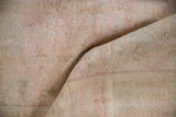 Hand-knotted foundation on the reverse of the distressed Oushak carpet with subtle color flecks.