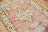 Vintage distressed Oushak runner, highlighting abrashed blush, ivory, brown motifs and soft, even wear.