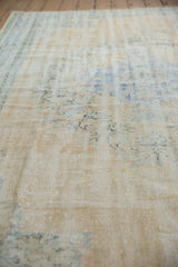 Texture of a distressed Oushak carpet showing mostly even wear across to the knot heads.