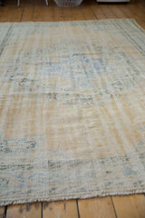 Worn hand-knotted pile of a vintage Oushak showing foundation and soft texture.