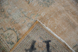 Vintage Distressed Oushak carpet showing worn pile, exposed foundation, reverse, and intact selvage.