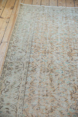 Vintage distressed Oushak carpet texture with mostly even wear, foundation showing faded apricot.