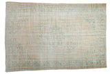 Vintage distressed Oushak carpet with faded peach, seafoam green medallion and floral motifs.