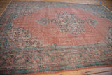 Distressed vintage Oushak border detail in aqua and ivory, with worn blush field.
