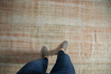 Textural close-up of vintage Oushak rug, highlighting pale rose and ivory distressed pile.