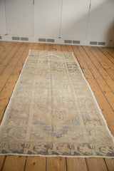 Distressed Oushak rug runner mid-section with time-softened sand, ivory, and slate blue abrashes.