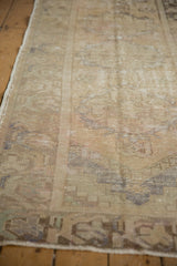 Distressed vintage Oushak runner pile, showing worn knot heads, sand tones, and subtle abrashes.