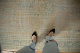 Distressed Oushak carpet showing faded apricot, ocean green pile with mostly even wear to knot heads.