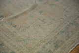 Distressed vintage Oushak rug texture, showing mostly even wear with faded ocean green.