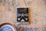 Pendleton Spider Rock CoasterRug with black, white, and brown geometric Southwestern pattern.