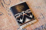 Pendleton Spider Rock Coasters in sleeve, showing geometric black, white, brown pattern with fringe.