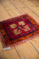 Hand knotted Oushak rug detail: cherry red, beige, sapphire floral pattern.