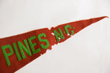 Close-up of antique Southern Pines NC felt flag, showing hand-sewn green letters and visible felt loss.