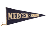 Antique Mercersburg felt pennant flag with hand-sewn cream block letters on dark blue, 14x32 inches.