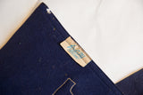 Maker's tag A&Co. NY on antique blue felt flag, showing fabric wear.