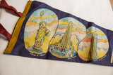 Vintage blue felt New York City pennant, featuring red tie, yellow binding, Statue of Liberty motif.