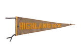 Antique Highland NY felt pennant with yellow block letters on a time-softened blue field.