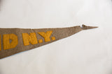 The historic tip of the antique felt pennant showing yellow N.Y. lettering and authentic wear.