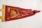 Vintage red felt pennant for Knott's Berry Farm showing slight creasing and full graphics.
