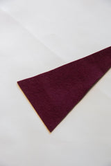 Rich burgundy felt texture of vintage Minnesota mini flag.