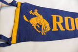 Close-up of the golden yellow Bronco Buster graphic on the blue felt Roosevelt flag.