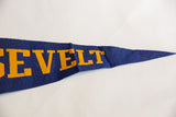 Angled view of the Roosevelt flag's tapered point with yellow letters on creased blue felt.