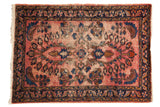 Vintage Lilihan rug, faded raspberry red with cobalt blue floral palmettes and navy border.