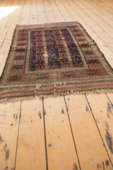 Natural beige fringe, worn and frayed on an antique Belouch rug.