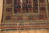 Madder root striped kilim and aged fringe of an antique Belouch rug.