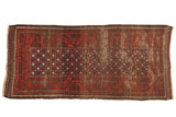 Antique Belouch rug runner, deep red and navy pomegranate starburst, worn, 2'9